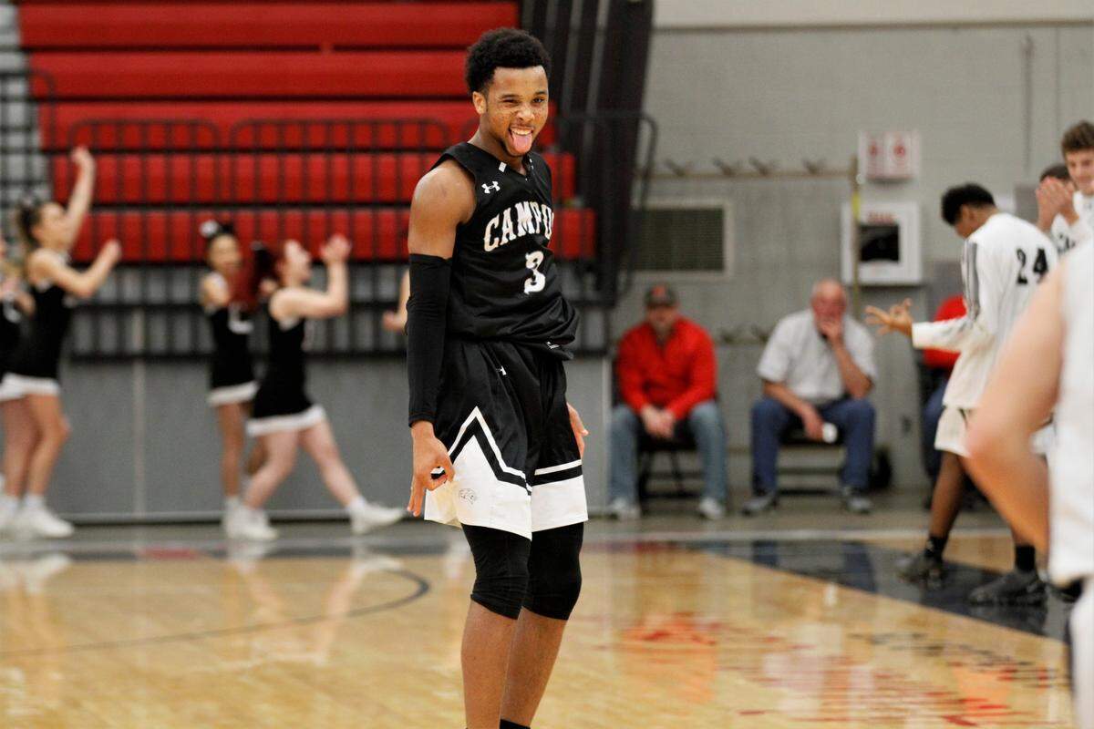 Campus sophomore Sterling Chapman sticks his tongue out and signals a three after hitting one during the Colts’ 57-39 win over previously undefeated Trinity Academy in the 2019 Bluestem Classic championship game Monday night. (Jan. 21, 2019)