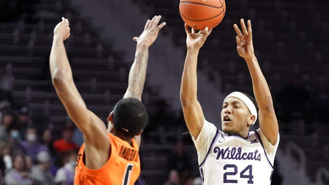 Kansas State guard Nijel Pack (24) puts up a three over Oklahoma State guard Avery Anderson III (0) during the second half of an NCAA college basketball game on Wednesday, Feb. 2, 2022, at Bramlage Coliseum in Manhattan, Kan. Kansas State defeated Oklahoma State, 71-68. (AP Photo/Nick Krug)