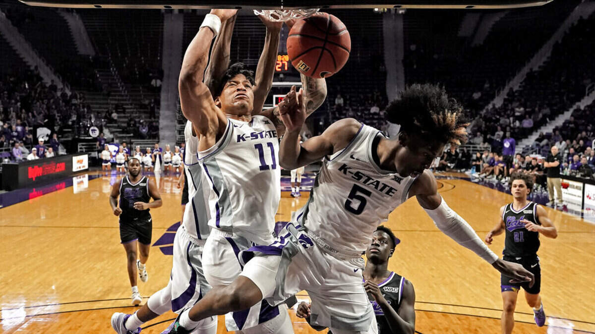 Kansas State forward Keyontae Johnson (11) dunks the ball during the second half of an NCAA college basketball game against Abilene Christian Tuesday, Dec. 6, 2022, in Manhattan, Kan. Kansas State won 81-64. (AP Photo/Charlie Riedel)
