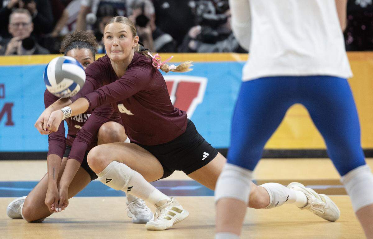 Texas A&M’s Emily Hellmuth digs the ball during their semifinal match against Pittsburg at the NCAA Volleyball Championship on Thursday night at the T-Mobile Center.