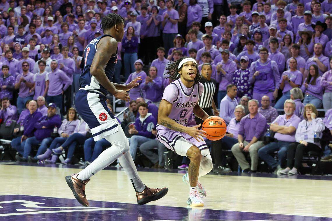Kansas State Wildcats guard Dug McDaniel (0) drives to the basket against Arizona Wildcats guard Jaden Bradley (0) during the first half at Bramlage Coliseum.