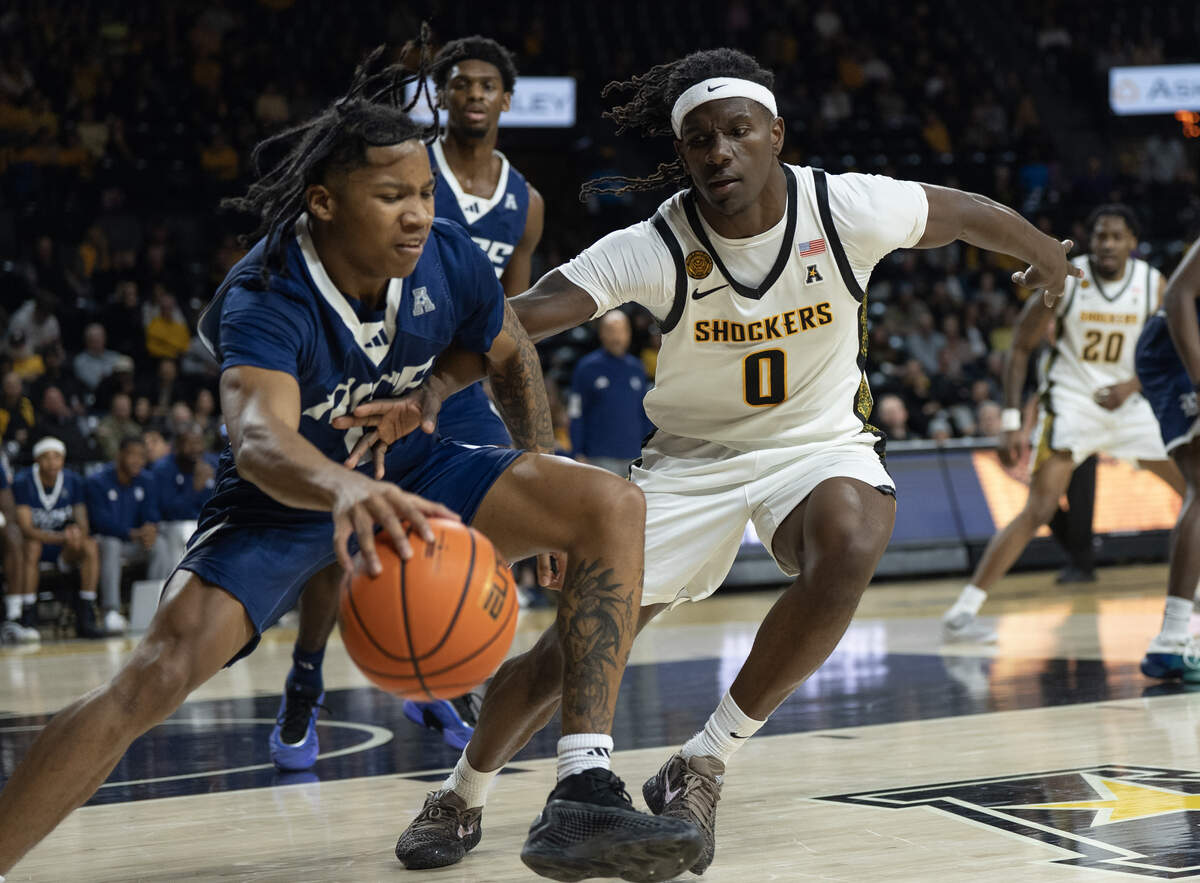 Wichita State’s Karon Boyd tries to steal the ball from Rice’s Cam Carroll.