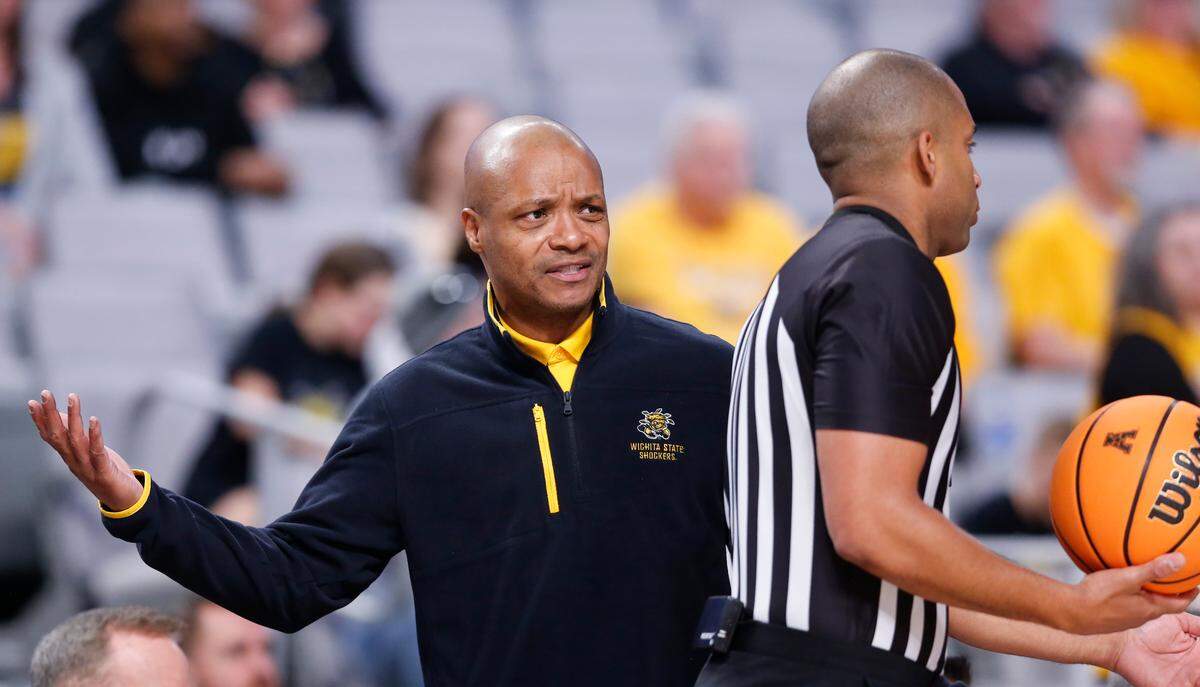 Wichita State coach Isaac Brown question a call during the second half of their first round game against Tulsa at the American Athletic Conference Tournament in Fort Worth on Thursday.