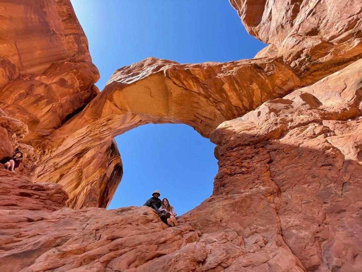 Thomas Doyle and his youngest daughter, Marlie, pose for a photo in March 2021 at Arches National Park in Utah.