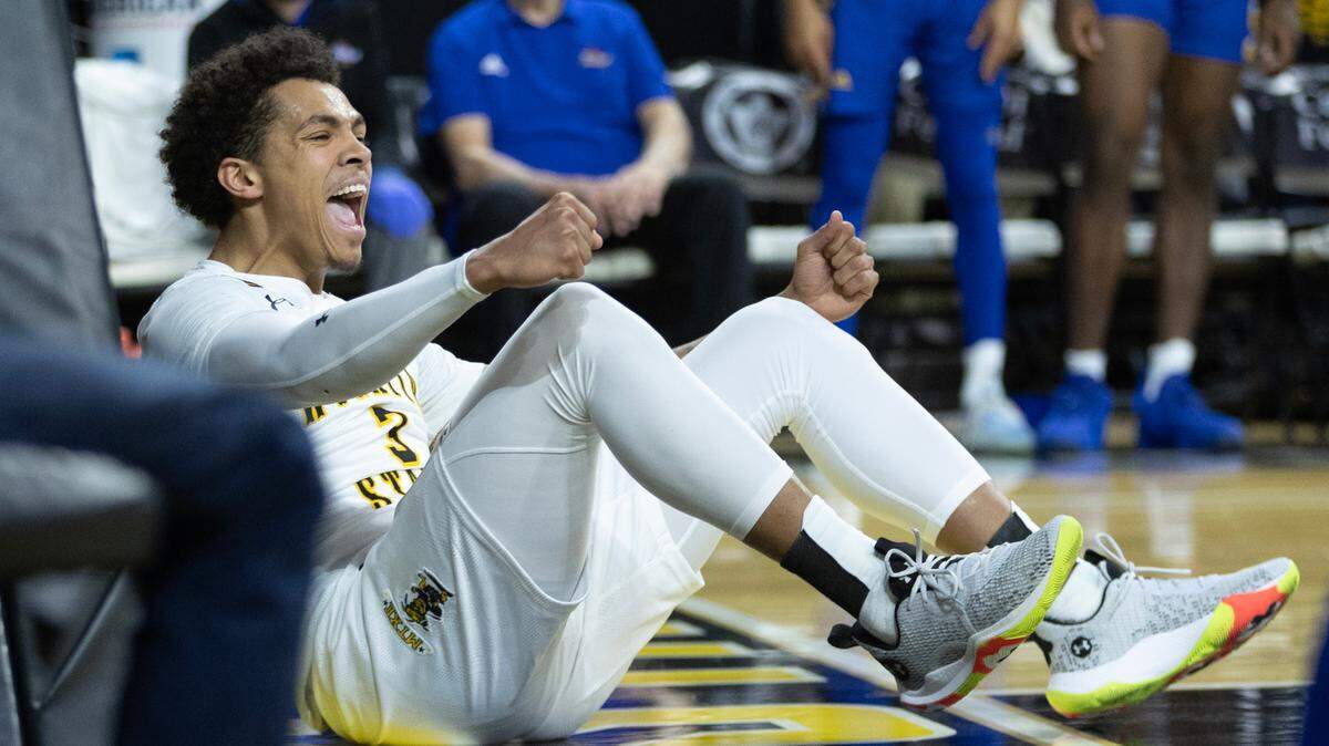 WIchita State’s Craig Porter Jr., celebrates a basket and a foul during the first half of their game against Tulsa on Saturday.