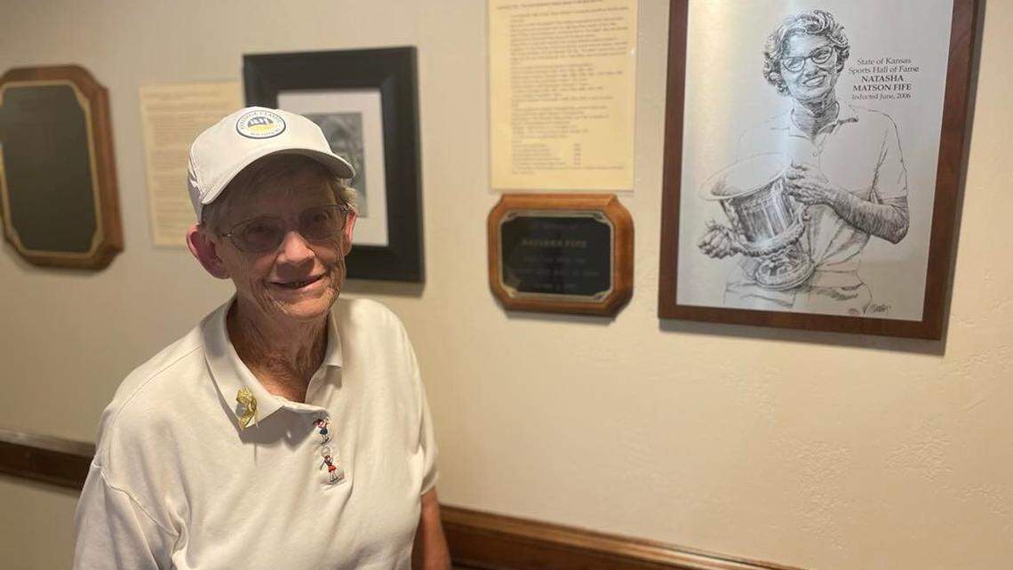 Natasha Fife, a Wichita women’s golf legend, poses next to her plaque inside Rolling Hills, which was the birthplace of the LPGA dating back to 1950.