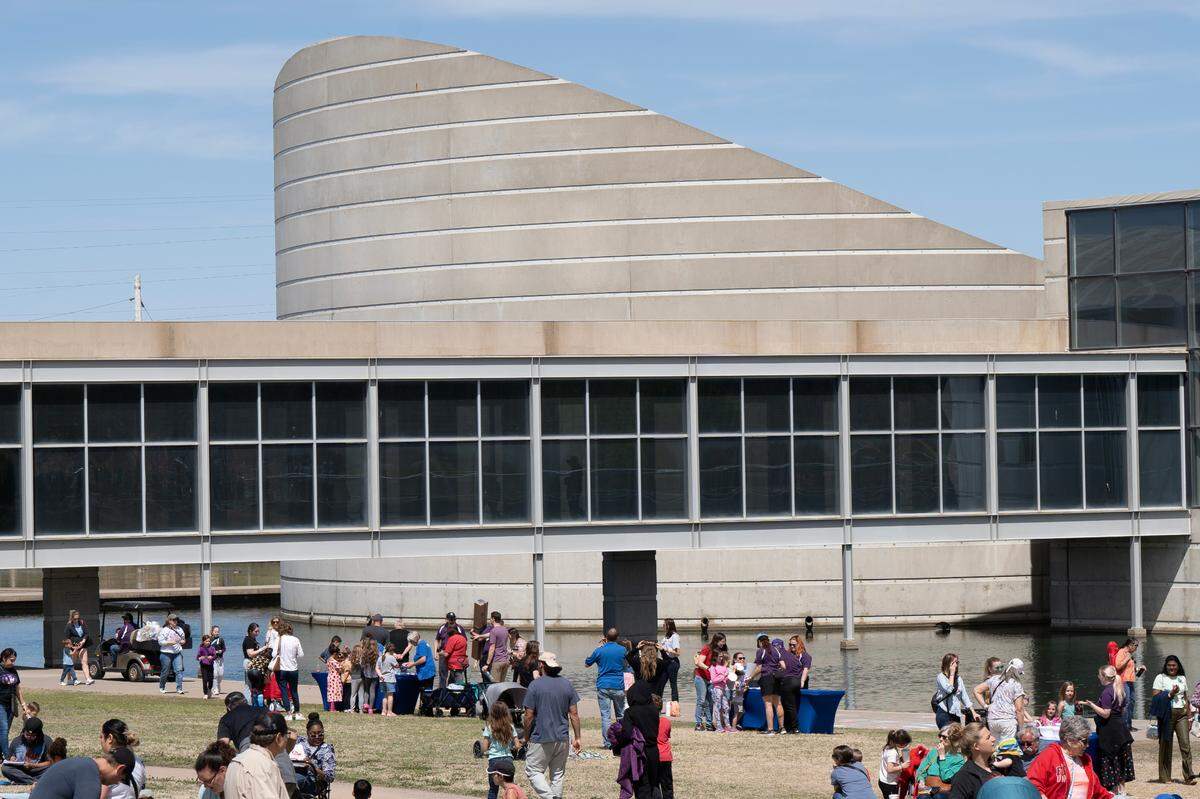 Several hundred people attended an eclipse party at Exploration Place on Monday.