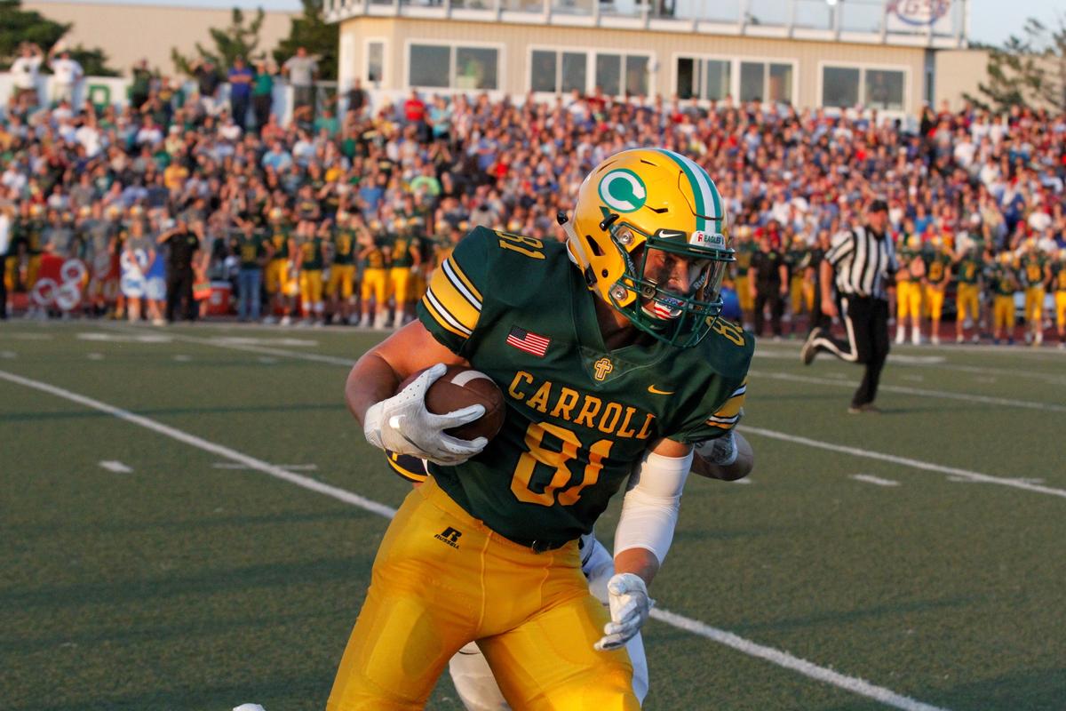 Bishop Carroll senior receiver Mason Baalman fields a catch along the sideline during the Golden Eagles’ 23-22 loss to Wichita Northwest on Friday night. (Aug. 31, 2018)