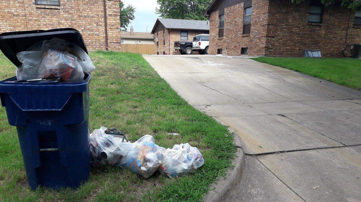 Two bail bondsmen were “rammed” by a young man who they were attempting to serve a warrant to in this driveway near Lincoln and Rock in east Wichita.