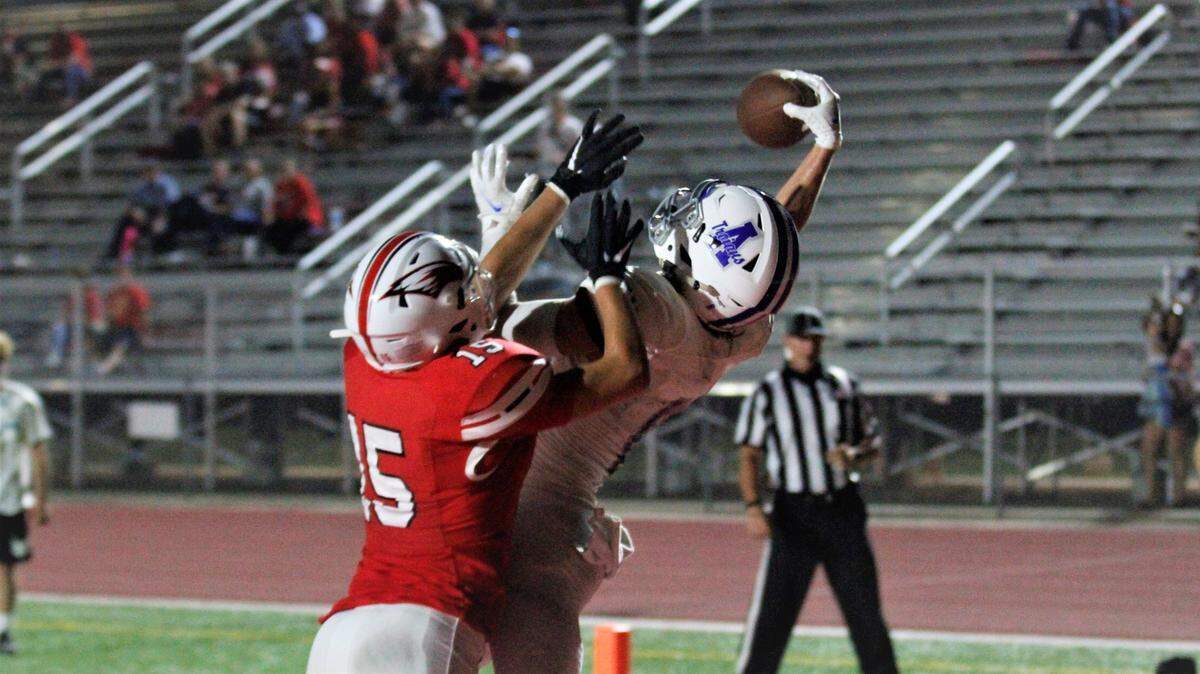 Maize’s Colby Pivarnik and Andover’s Quentin Born battle in the end zone.