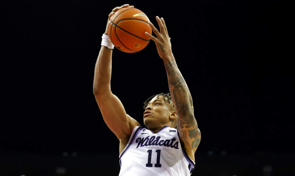 Kansas State forward Keyontae Johnson grabs a rebound during the first half of an NCAA college basketball game against Nebraska in Kansas City, Mo., Saturday, Dec. 17, 2022.