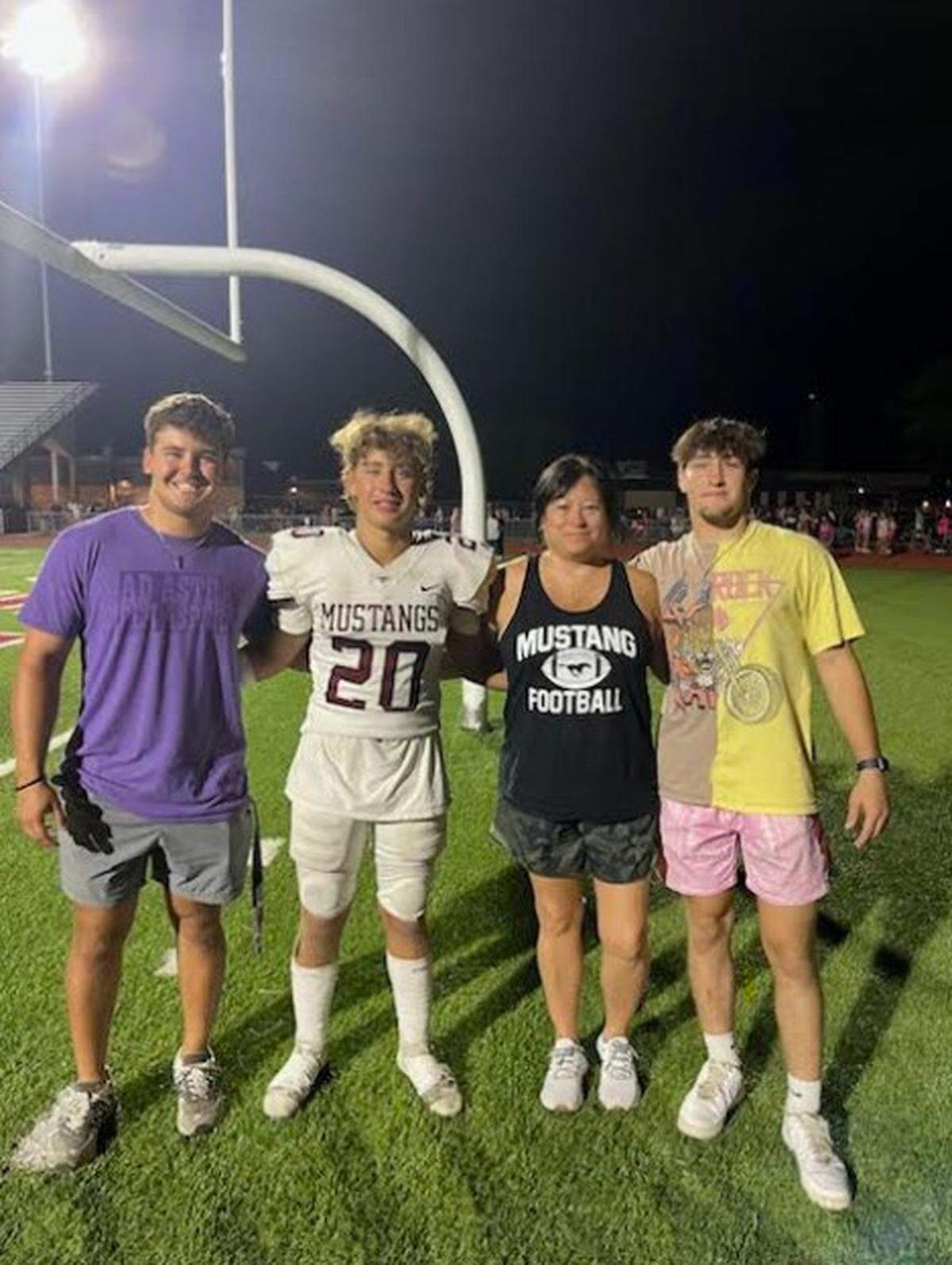 Pictured from left to right: Dakota Hogan, Chance Hogan, Dana Bonilla Hogan and Dawson Hogan during a Salina Central High School football game.