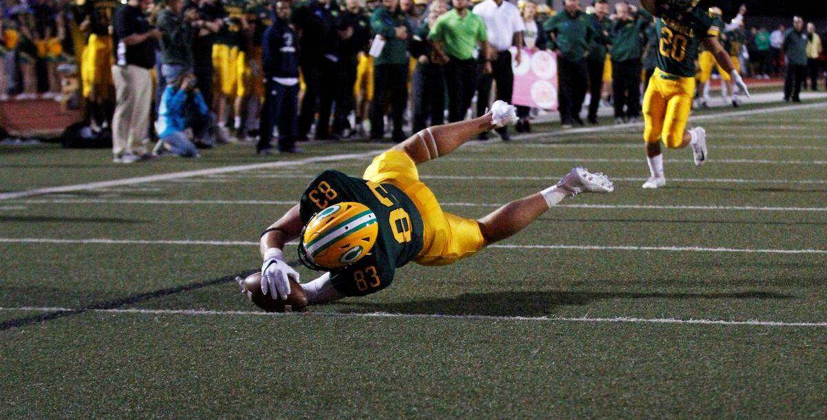 Bishop Carroll senior tight end Clay Cundiff lays out for a touchdown in the Golden Eagles’ 24-6 loss to Derby on Friday night. (Sept. 21, 2018)