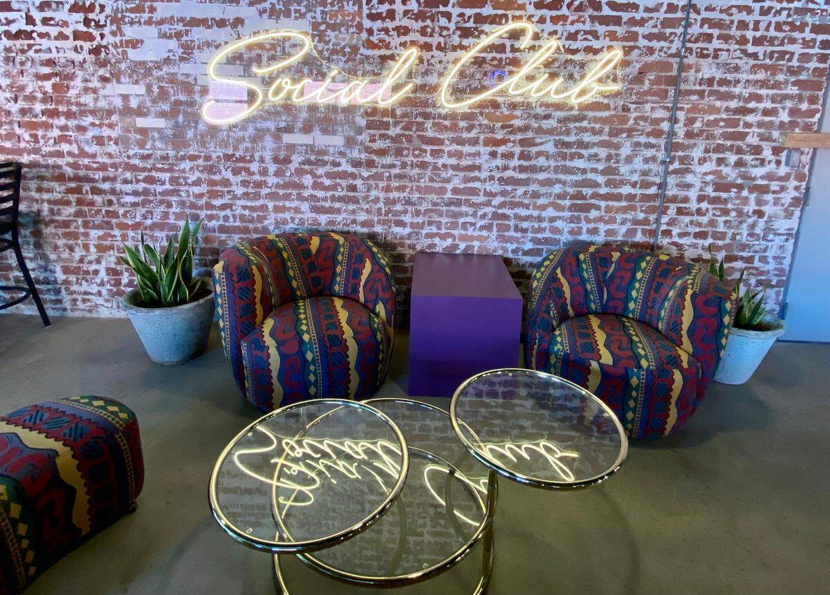 The new bar Douglas Social is filled with “1980s deco” furnishing found by owner Travis Hatfield’s wife, Cass, and sister, Sumer Crane.