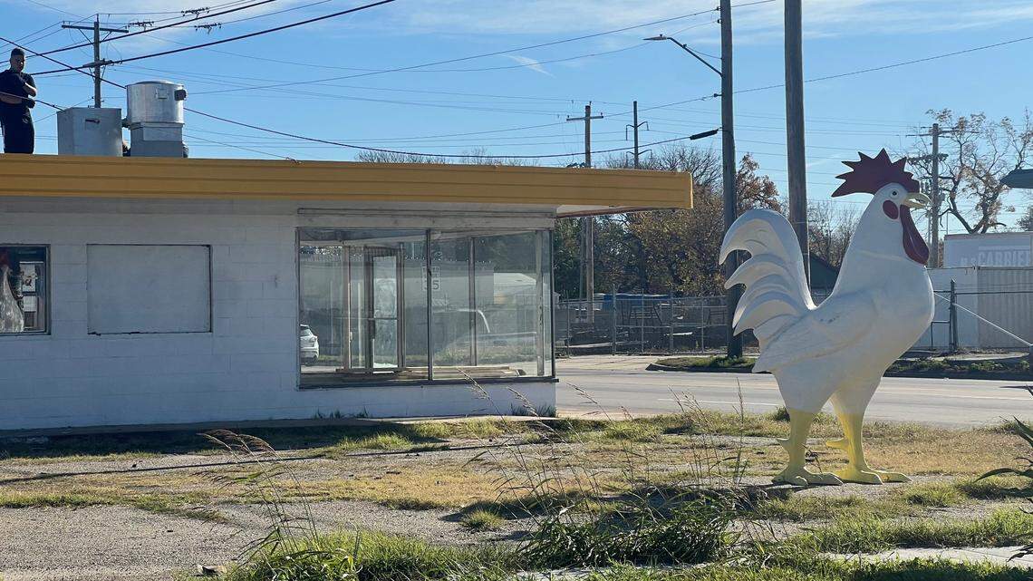 If you’ve driven past 13th and Mosley in the last few weeks, you’ve no doubt noticed the giant chicken statue standing all alone at the northeast corner of the intersection. She (or he, if he’s actually a rooster) is signaling a new Chicken Chicken restaurant to come.