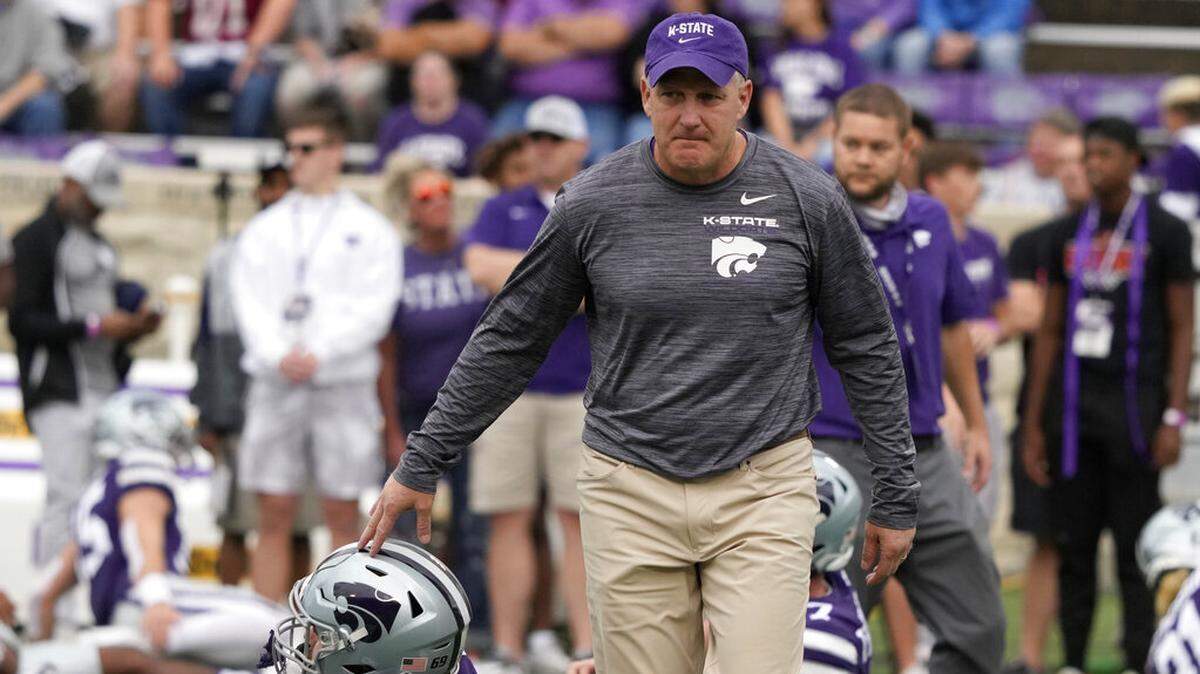 Kansas State head coach Chris Klieman taps the helmet of offensive lineman Noah Johnson before the game against Oklahoma in Manhattan, Kan., Saturday, Oct. 2 2021.