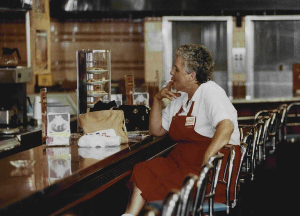 A cook at the downtown Woolworths is pictured at the counter in 1990