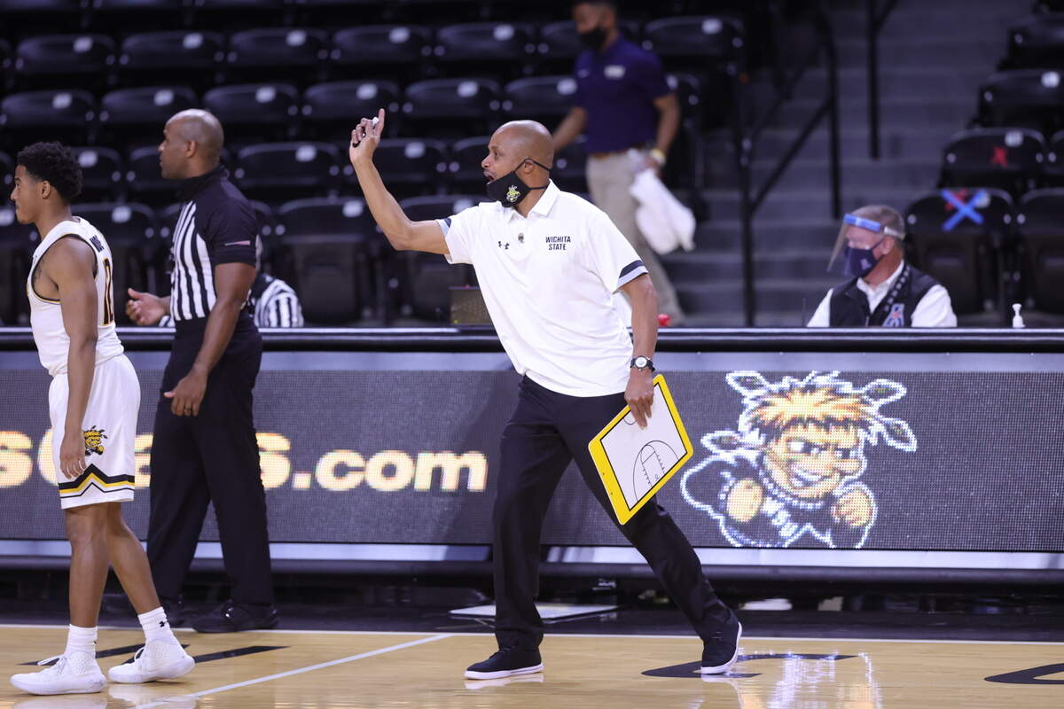 Isaac Brown became the first Black head coach in Wichita State men’s basketball history when the interim coach led the Shockers to an 85-80 victory over Oral Roberts on Wednesday.