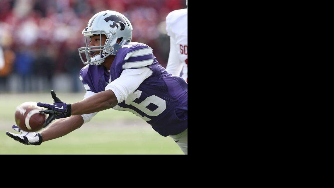 Kansas State wide receiver Tyler Lockett dives for a pass last season. Lockett is back for his senior, intent on breaking family records, school records and playing for a national championship.

