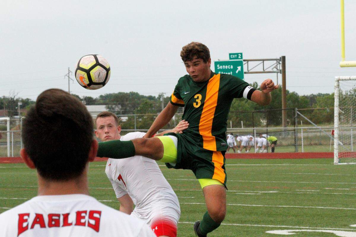 Carroll senior defender Brad Huslig goes for a ball during the Golden Eagles’ 1-0 win over Maize on Monday. (Sept. 3, 2018)