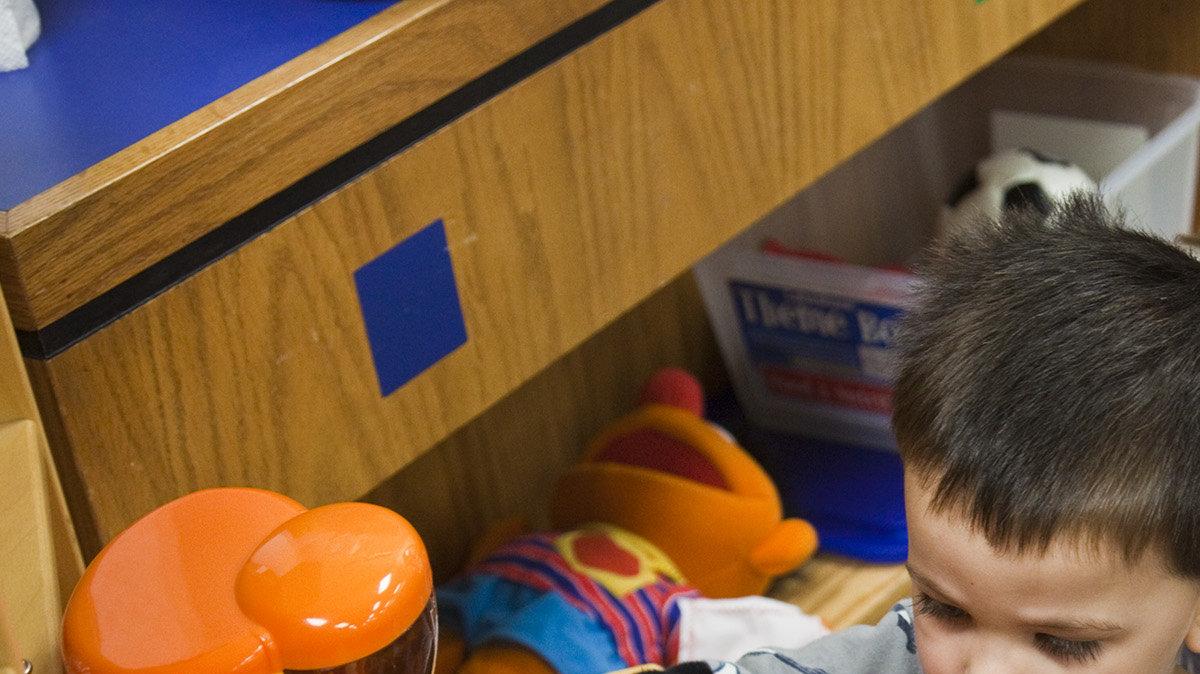 Lori Gambill and son Kai, 2, make an imaginary pot of coffee during a Parents as Teachers playgroup program at Adams Elementary Friday, Apr. 22, 2011.