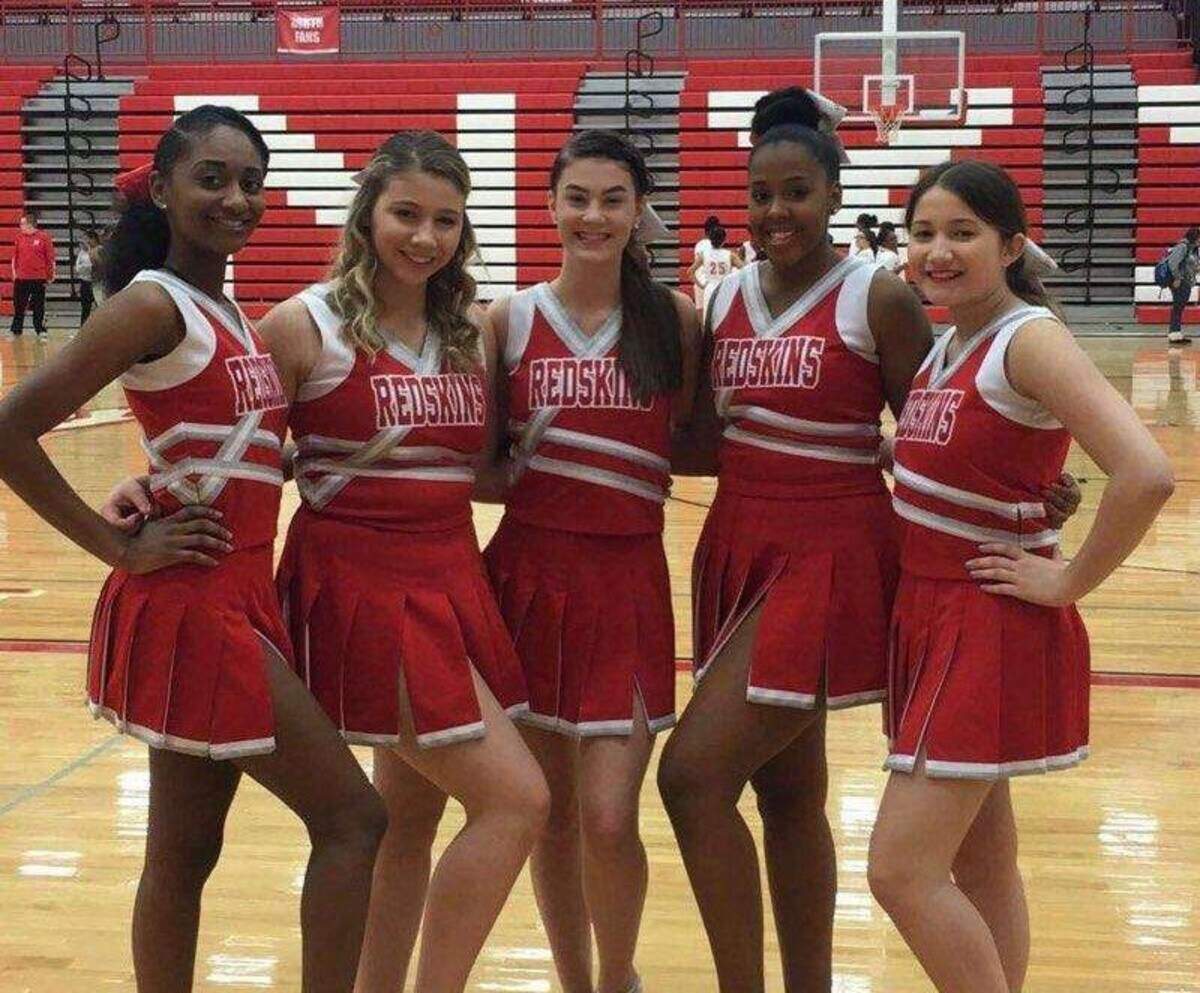 From left: Destiny Buggs, Caitlyn Meraz, Brittnee Wicker, Whitney Mayberry and Tyla PrudHomme-Delodder pose for a photo while cheerleading for North High School.