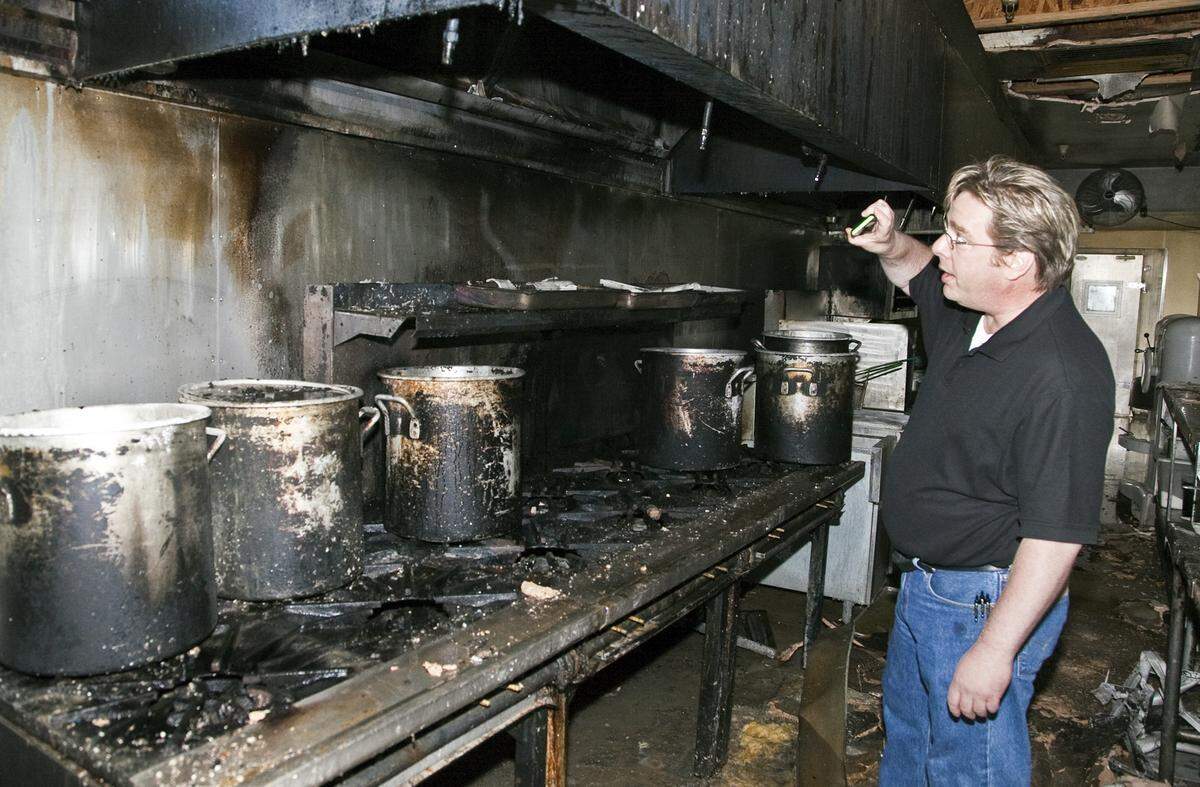 Kevin Allis is pictured inside Stroud’s in 2014, after its kitchen was damaged by fire.