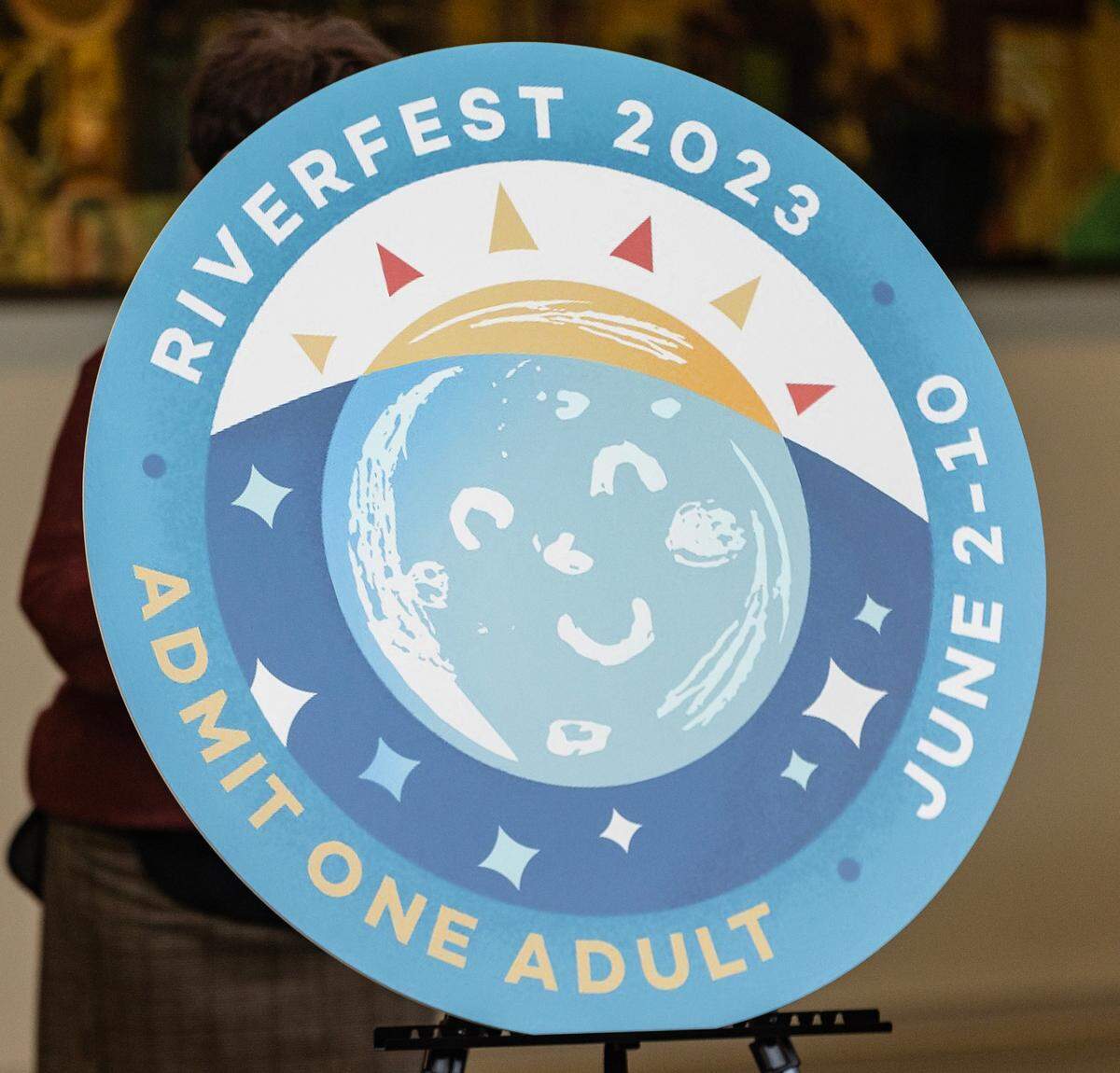 A sun features prominently in the design for this year’s Riverfest button.