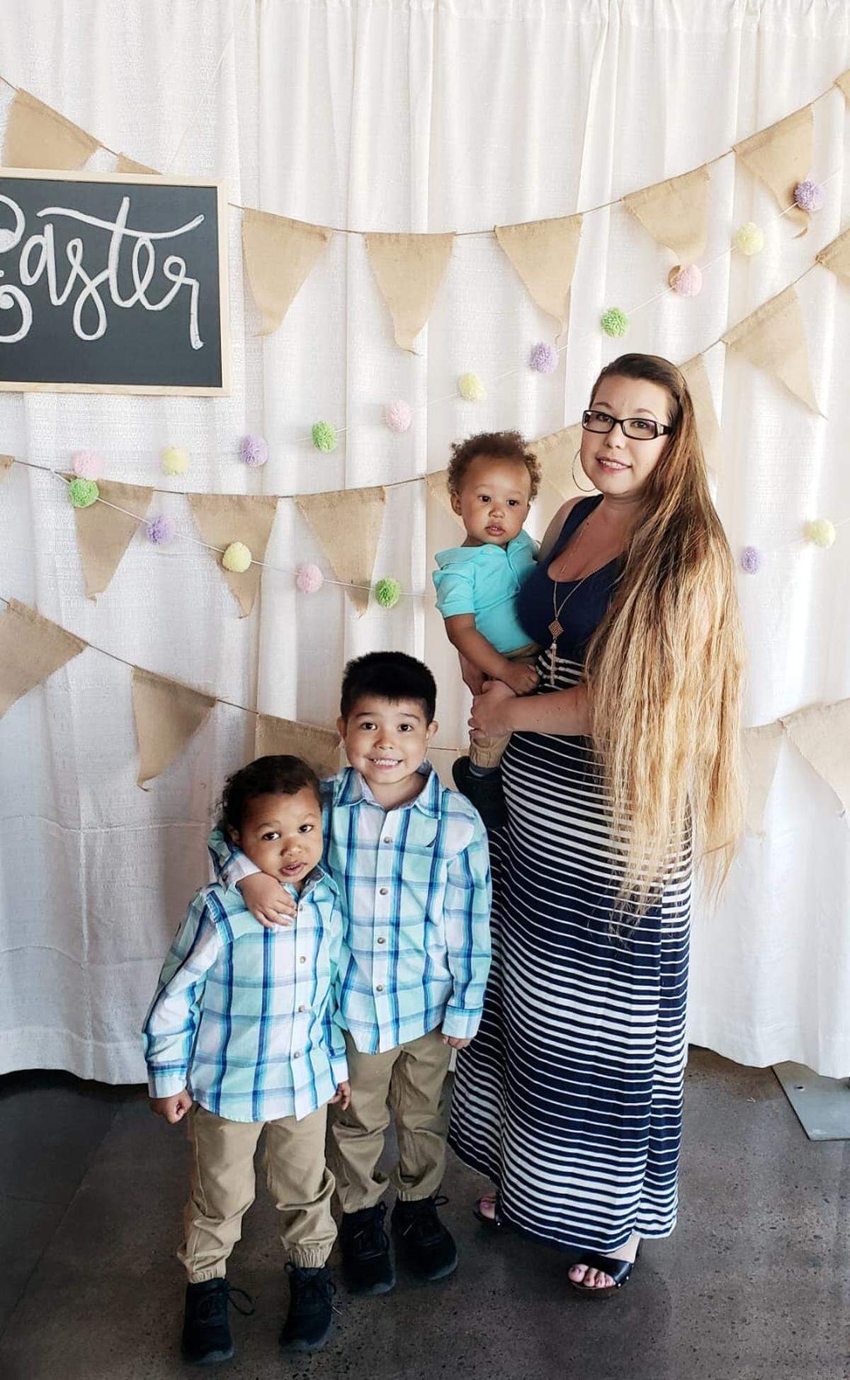 Omari Garcia is being held by his mother, Diocelina Garcia, and alongside his older brothers in a 2019 Easter Sunday photo. Omari drowned in a south Wichita swimming pool in July 2020.