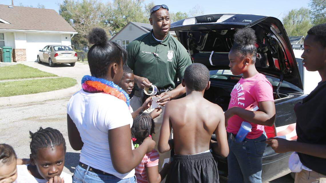 The Wichita City Council wants to add more police officers so those on patrol have more opportunities to build relationships - like Officer Donielle Watson is here in his northeast Wichita beat in 2013.