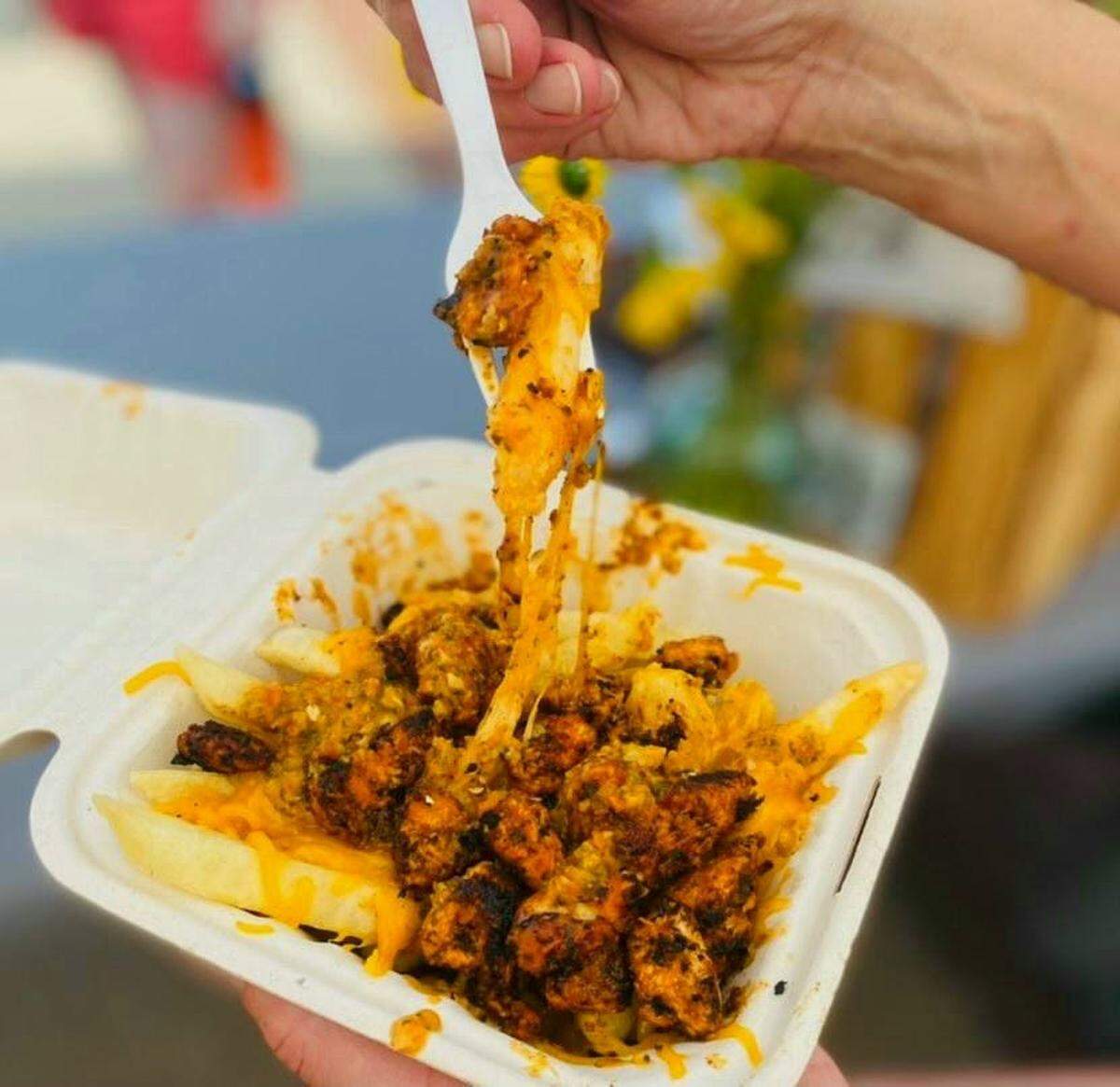 Fries topped with Portuguese-style chicken are another specialty at Travieso’s Food Company.