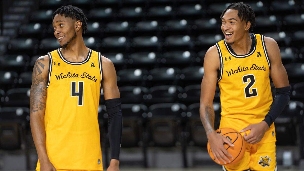 Wichita State Men’s Basketball players Colby Rogers, left, and Jalen Ricks, right, laugh at a teammate during media day.