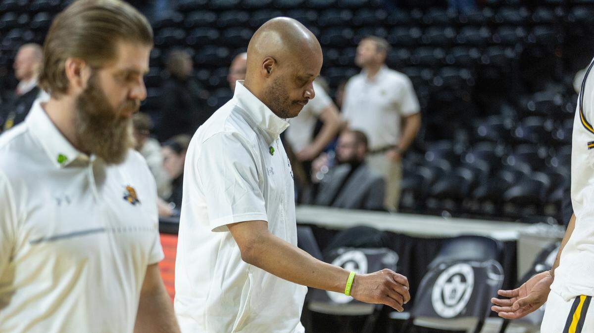 Wichita State coach Isaac Brown walks off the court after the Shockers squandered an 11-point second half lead to lose 72-67 to Central Florida.