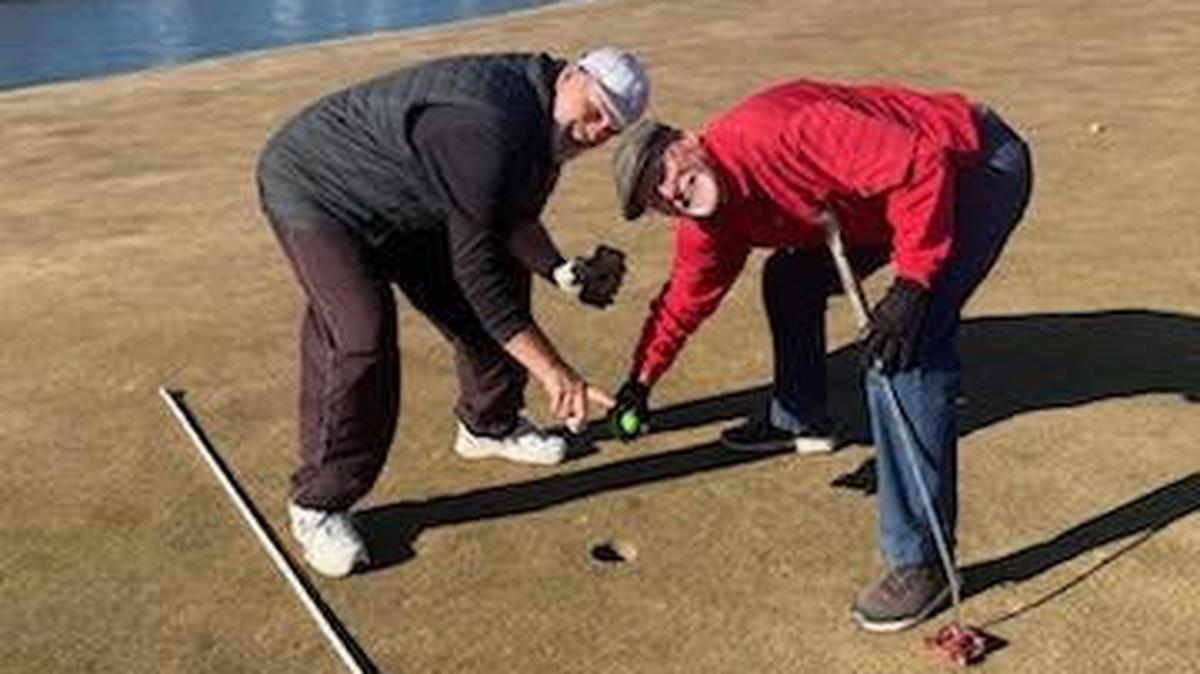 Leroy Leep, left, and Mike McMillin celebrate at hole No. 4 at Auburn Hills Golf Course Sunday where they both hit a hole-in-one. The National Hole-In-One Registry said there’s only a 1-in-17-million chance of two golfers each getting a shot straight in the same hole while playing together.