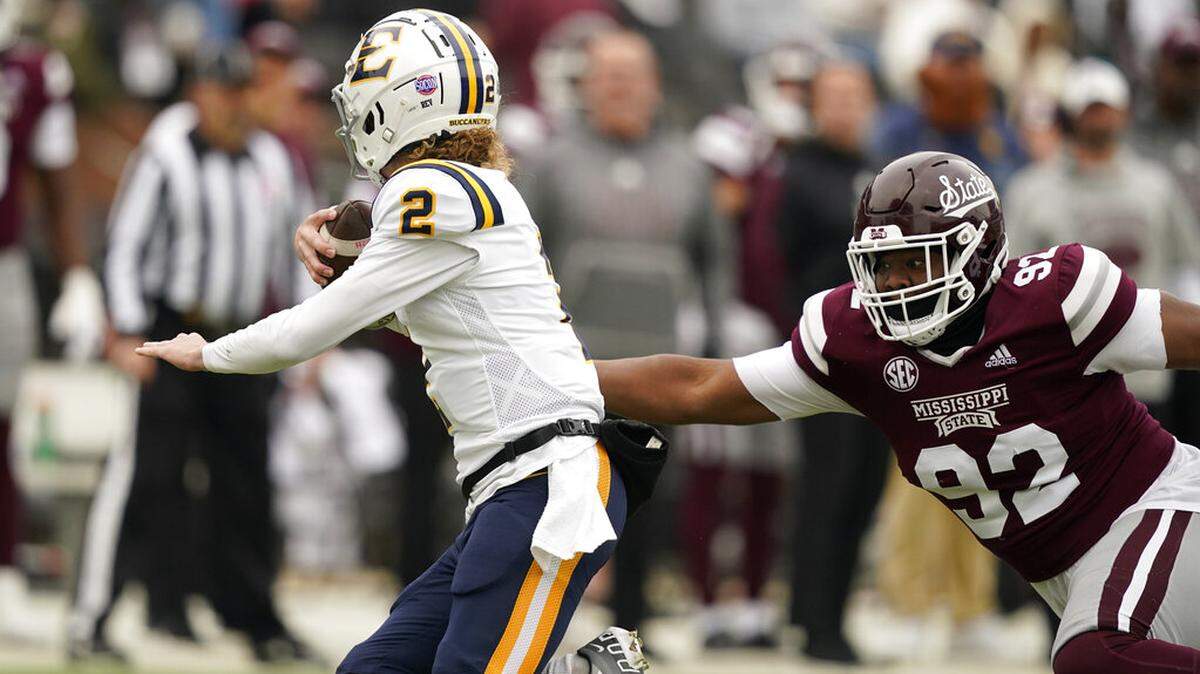 East Tennessee State quarterback Tyler Riddell (2) is pursued by Mississippi State defensive end Jevon Banks (92) during an NCAA college football game in Starkville, Miss., Saturday, Nov.19, 2022. Mississippi State won 56-7. (AP Photo/Rogelio V. Solis)