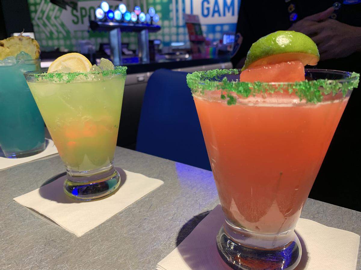 Parents can lounge with colorful cocktails in the Dave & Buster’s bar while the kids play games.