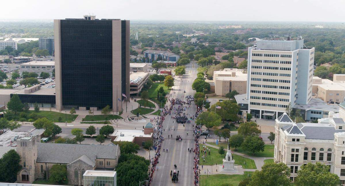 A horse-drawn caisson leads the body of Father Emil Kapaun to the Cathedral of Immaculate Conception in downtown Wichita on Wednesday afternoon. Kapaun, a Medal of Honor recipient, died in a North Korean prisoner of war camp in 1951. His remains were identified earlier this year and today he was finally laid to rest. (September 29, 2021)