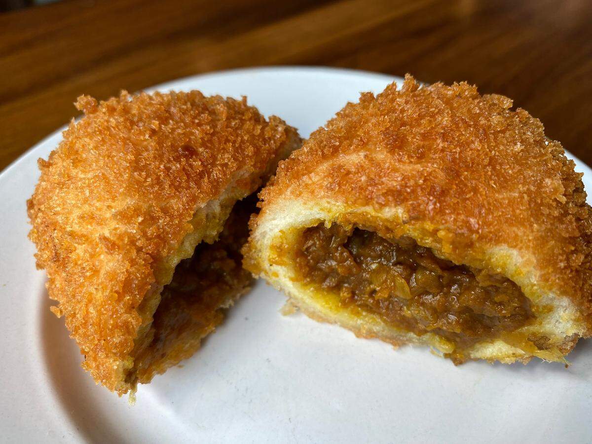 Savory curry buns, which are soft in the center and crunchy on the outside, are one of the most popular items at Komuji Japanese Bakery.