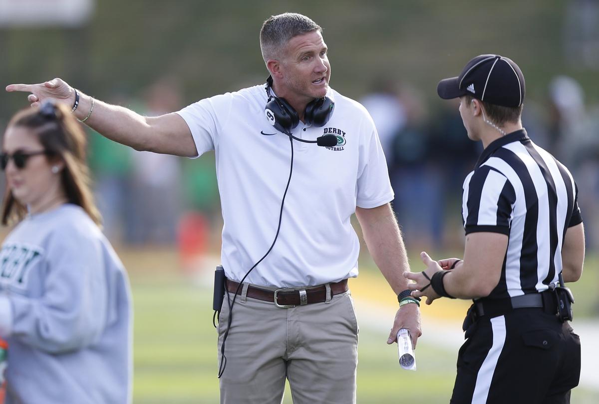 Derby head coach Brandon Clark questions a call Saturday as Derby took on Blue Valley North in the 6a State Championship.  (November 24, 2018)