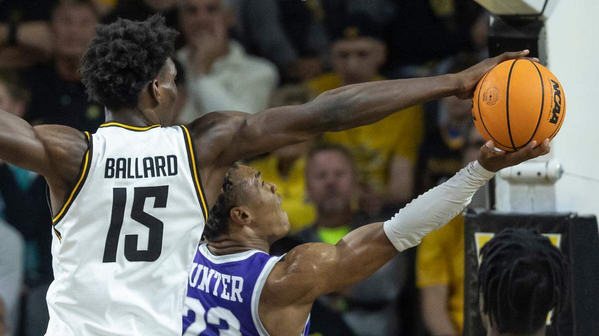 Wichita State’s Quincy Ballard blocks the shot of Central Arkansas’ Camren Hunter during the first half of their season-opening game on Monday night.