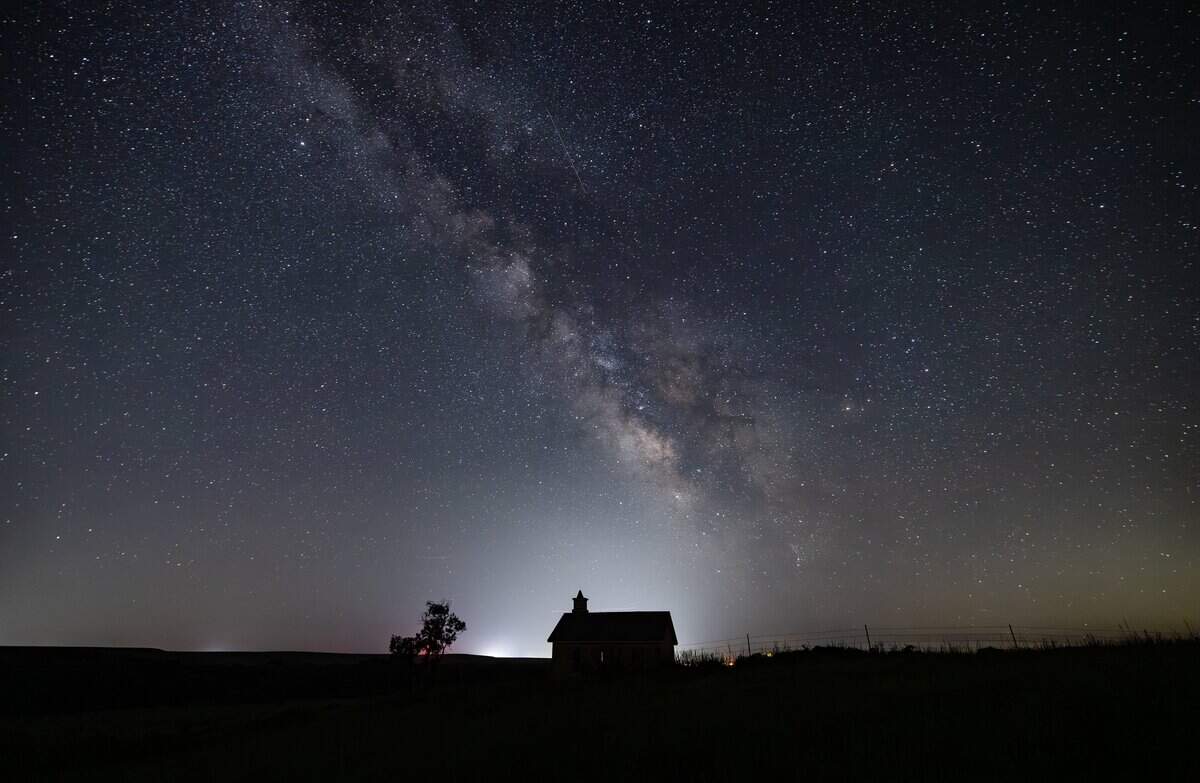 The Milky Way galaxy can be seen in the southern sky from the Lower Fox Creek Schoolhouse at the Tallgrass Prairie Preserve on Tuesday night. The galaxy is best viewed away from city lights in the summer, when the earth's orbital position faces the galaxy's star-filled core.