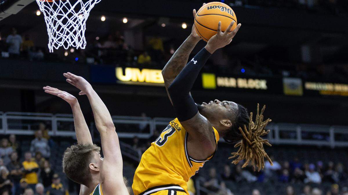 Wichita State’s Gus Okafor goes up for a shot against San Francisco’s Julian Rishwain during the second half of their championship game of the Hall of Fame Classic in Kansas City on Tuesday.