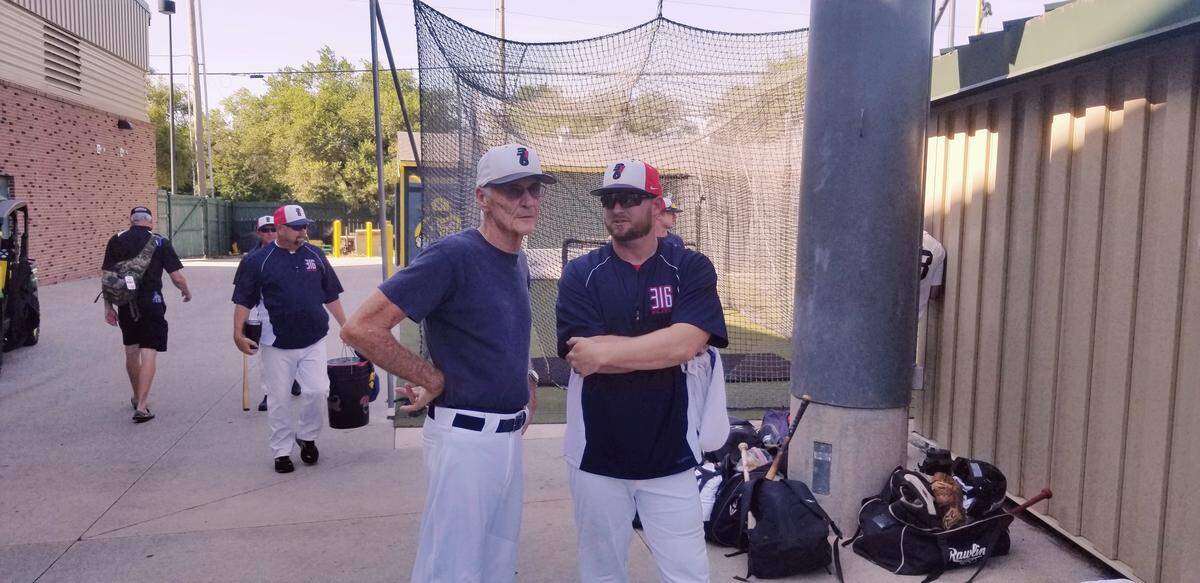 At age 76, the passion to coach baseball is still alive in John Dreifort (left). He is coaching the 316 Elite team in the National Baseball Congress World Series this week at Eck Stadium.