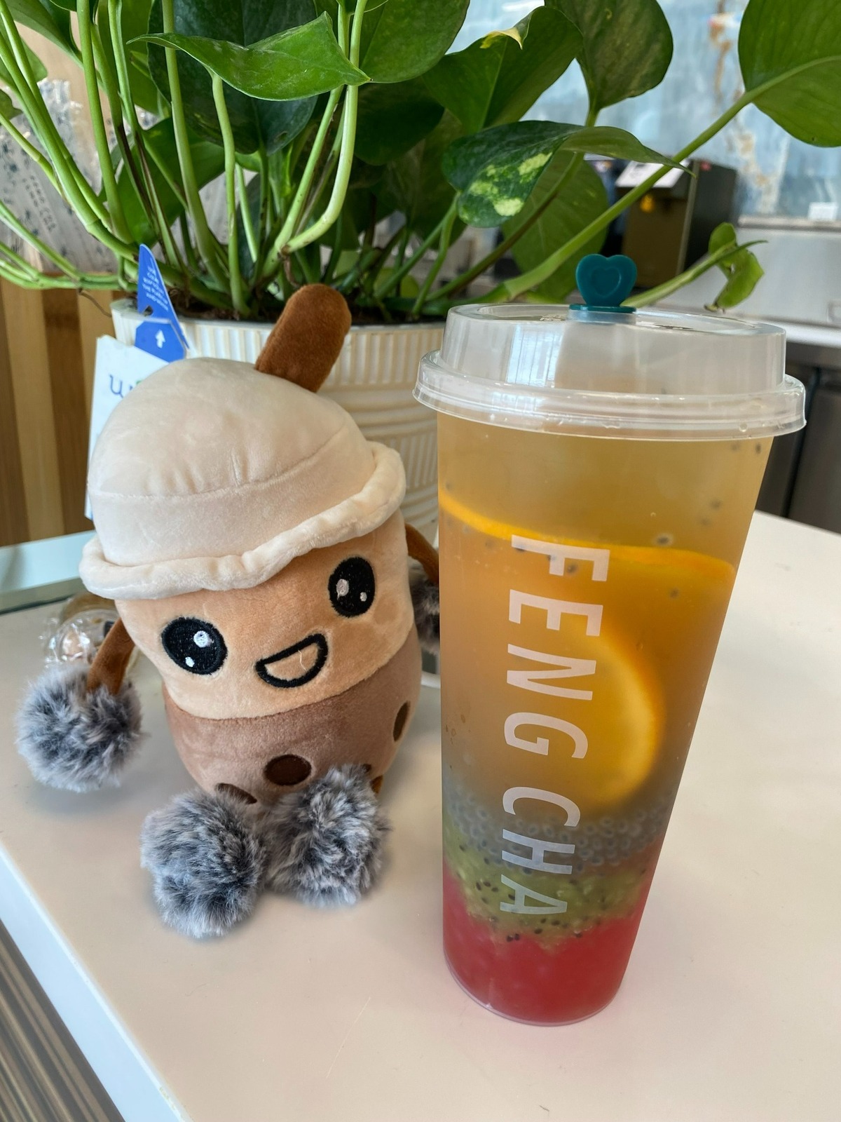 A popular and colorful fruit tea sold at Feng Cha is the kiwi basil green tea.