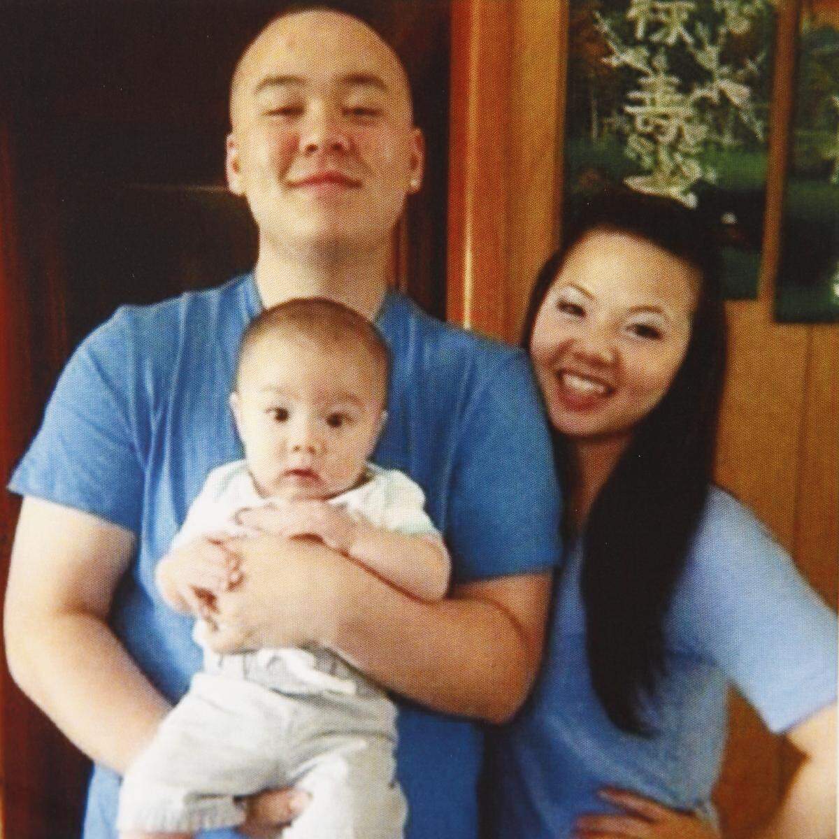 Sean Pham and Trinh Pham pose for a family photo with their baby. Sean and Trinh were shot and killed in their home on June 24, 2014, along with Trinh’s mother, Tuyet Huynh. The baby was asleep at the time and was not hurt in the shooting.