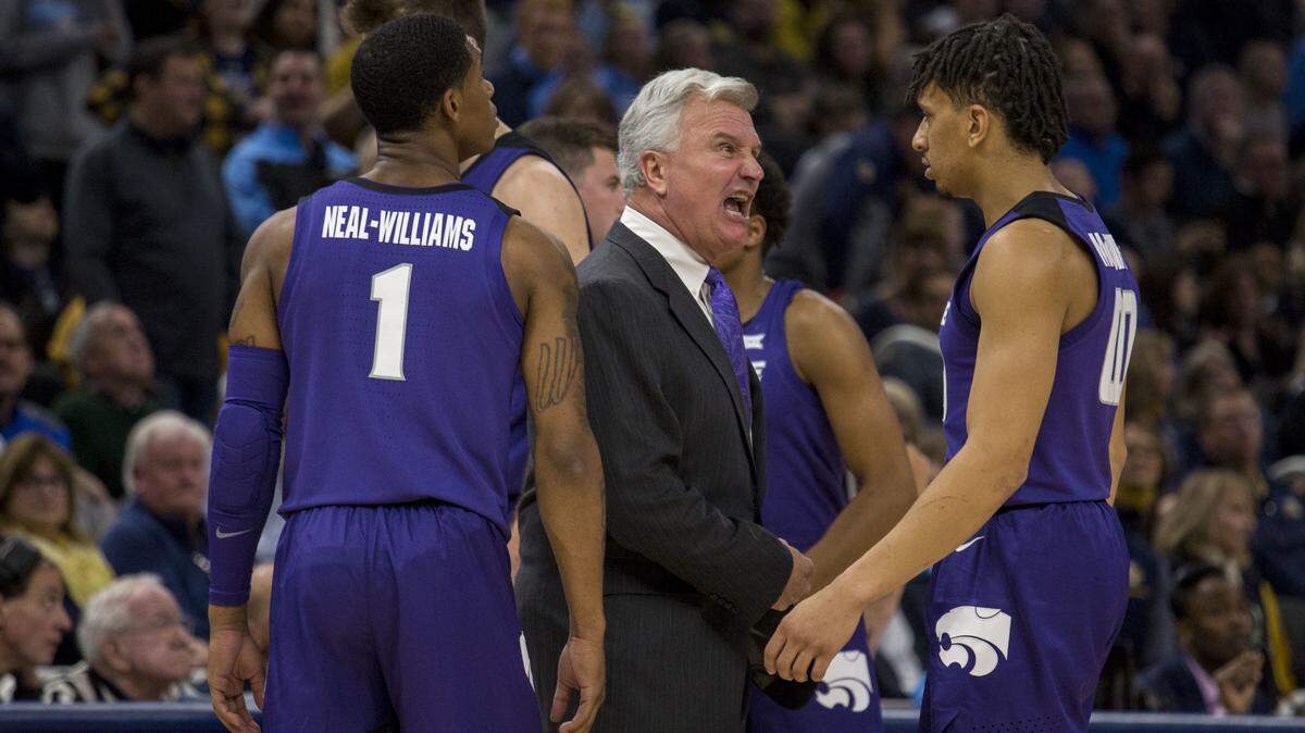 Kansas State head coach Bruce Weber, center, yells at Mike McGuirl, right, as they take on Marquette during the first half of an NCAA basketball game Saturday, Dec. 1, 2018, in Milwaukee. (AP Photo/Darren Hauck)