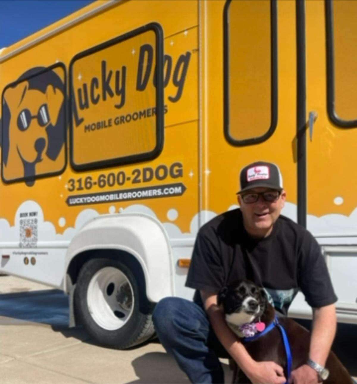 Lucky Dog Mobile Groomers licensee Shelby Sheils is expanding his Wichita business, first with more vehicles and then with new markets. He’s shown here with Skye, his friend’s dog who was groomed in Sheils’ first vehicle. Sheils is preparing to get a second vehicle ready for the Wichita area.