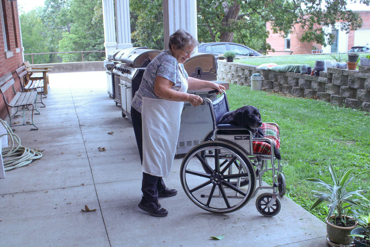 Sister Loretta McGuire takes Sophie, who has arthritis, to spend time outside.