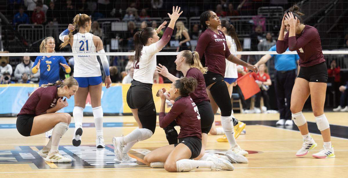 Texas A&M players react at the end of the third set to complete a sweep of Pittsburgh during the first semifinal match Thursday night at the NCAA Volleyball Championship at the T-Mobile Center.