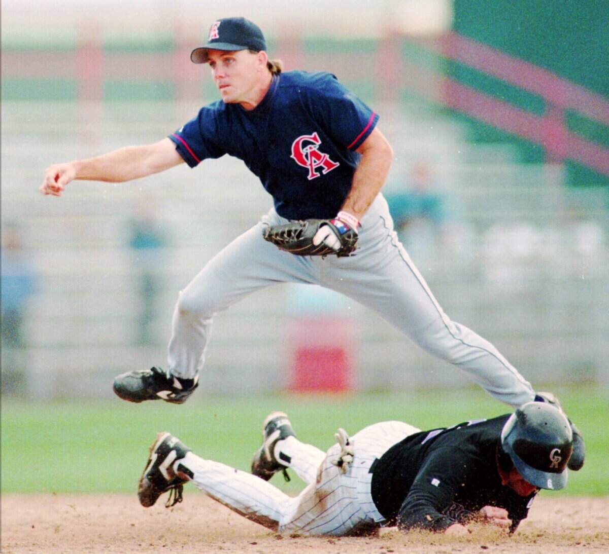 Former Wichita State standout P.J. Forbes, who played for the California Angels in the majors, is the father of Kendall Forbes, who won the Class 5A softball title with Bishop Carroll on Friday.